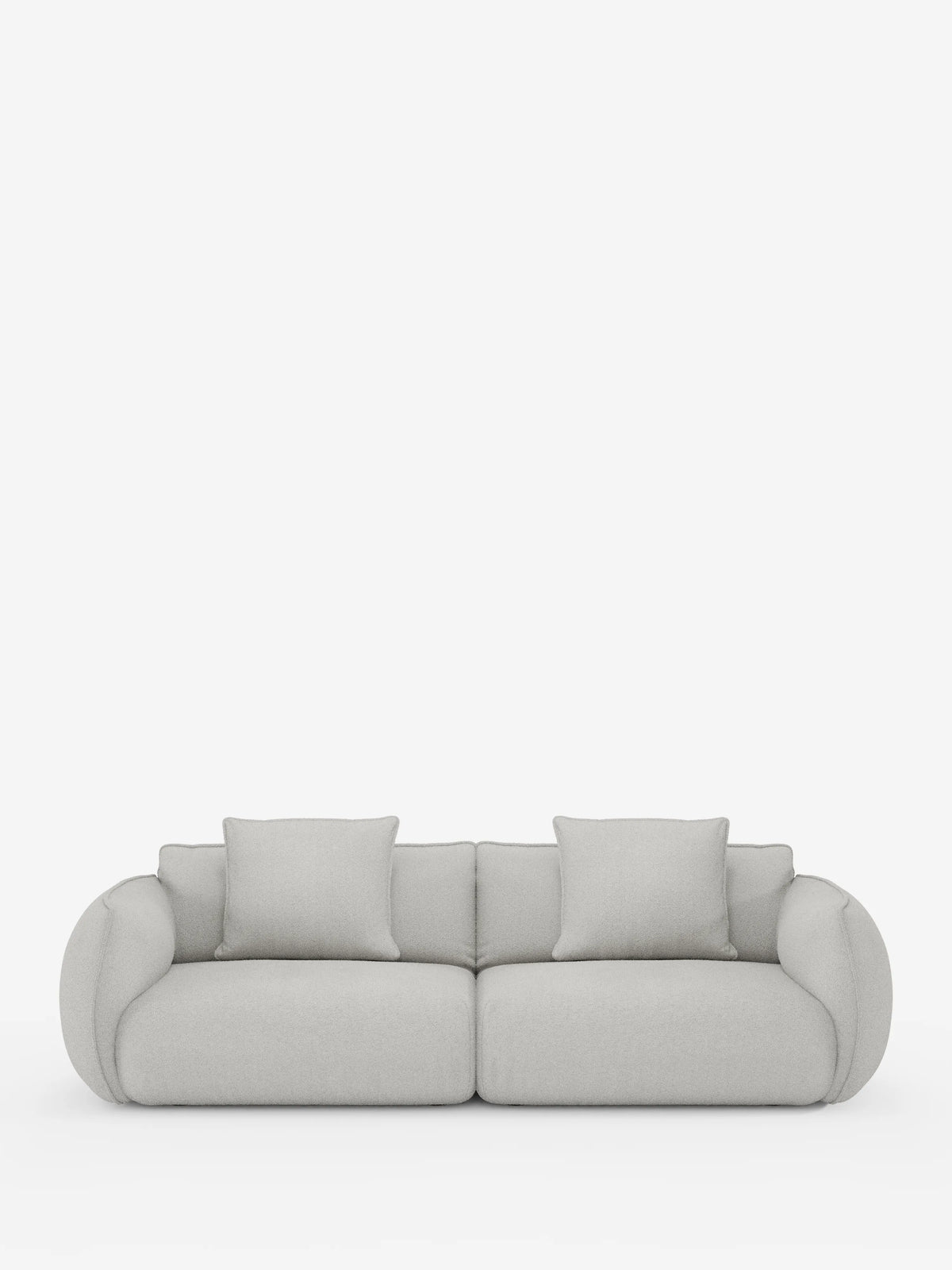 Il divano Nimbus, un modello contemporaneo a 3 posti, modulare e componibile da 250 cm di divitt.sbs, è presentato su uno sfondo bianco a tinta unita. Rivestito in tessuto grigio chiaro effetto cotone antimacchia (t33), questo divano presenta braccioli e schienale lisci e arrotondati, due generosi cuscini di seduta e due cuscini quadrati abbinati per lo schienale. Il suo design minimalista esalta sia lo stile che il comfort, con fodere completamente sfoderabili per una facile manutenzione.
