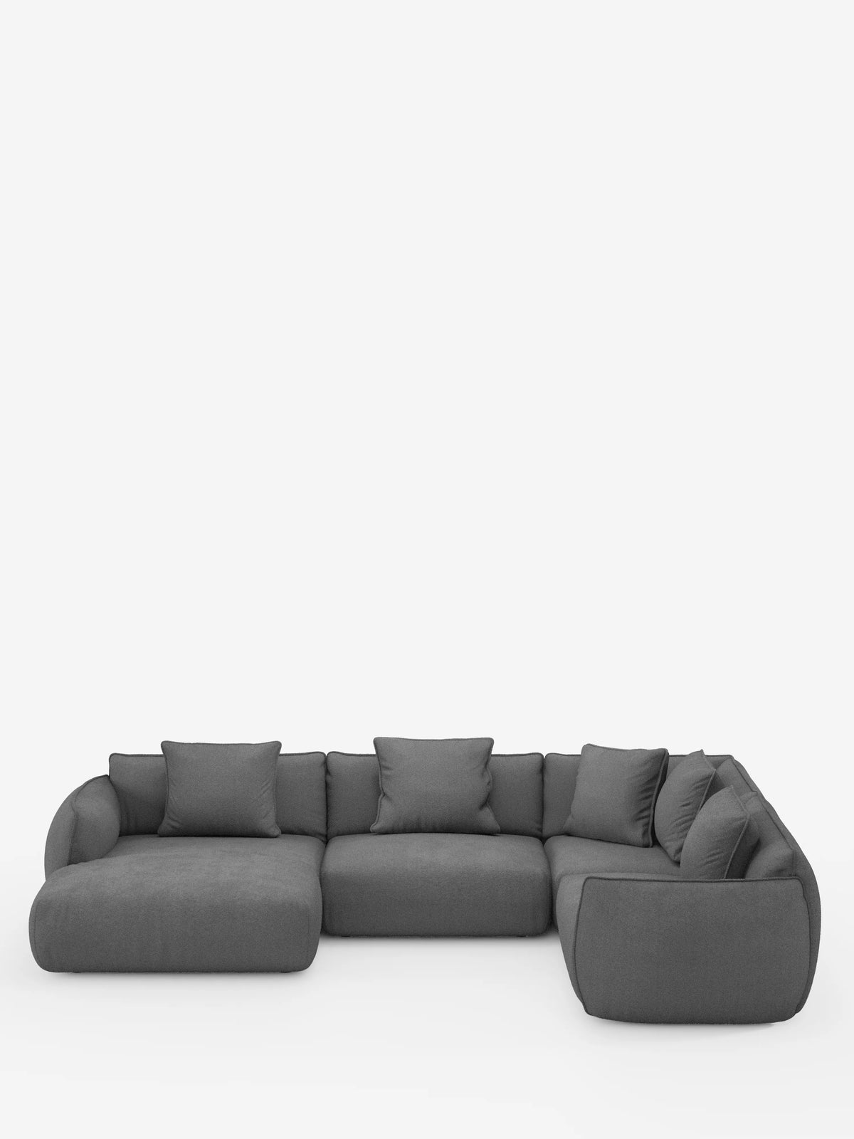 Un divano angolare panoramico componibile Nimbus, moderno e minimalista, con penisola e angolo in tessuto smacchiabile T33 di divitt.sbs, rivestito in grigio scuro, caratterizzato da morbidi cuscini e braccioli. Questo divano modulare a forma di L, di produzione italiana, è composto da tre sezioni di seduta ed è impreziosito da sette cuscini decorativi coordinati, il tutto su uno sfondo bianco a tinta unita.