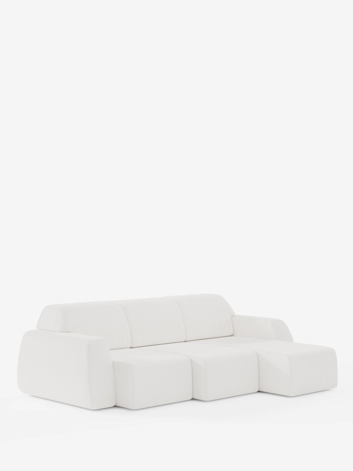 Il divano angolare Orbit con penisola reversibile e tutte le sedute allungabili in tessuto smacchiabile effetto cotone T33 di divitt.sbs è un divano componibile moderno e minimalista di colore bianco, caratterizzato da tre cuscini di seduta, braccioli bassi e arrotondati e una silhouette senza gambe — qui raffigurato su uno sfondo bianco a tinta unita.