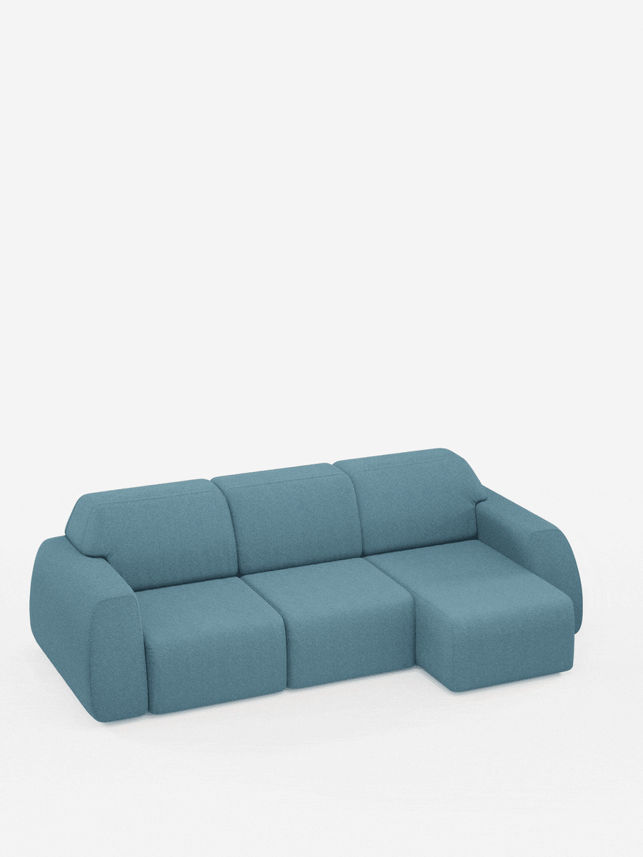 Il divano angolare Orbit con penisola reversibile e tutte le sedute allungabili in tessuto smacchiabile effetto cotone T33 di divitt.sbs è un divano componibile contemporaneo caratterizzato da braccioli curvi e linee morbide. Rivestito in tessuto color verde acqua, resistente alle macchie ed effetto cotone, questo divano minimalista include una chaise longue reversibile posizionata sulla destra e si presenta su uno sfondo bianco senza giunture, senza gambe a vista.