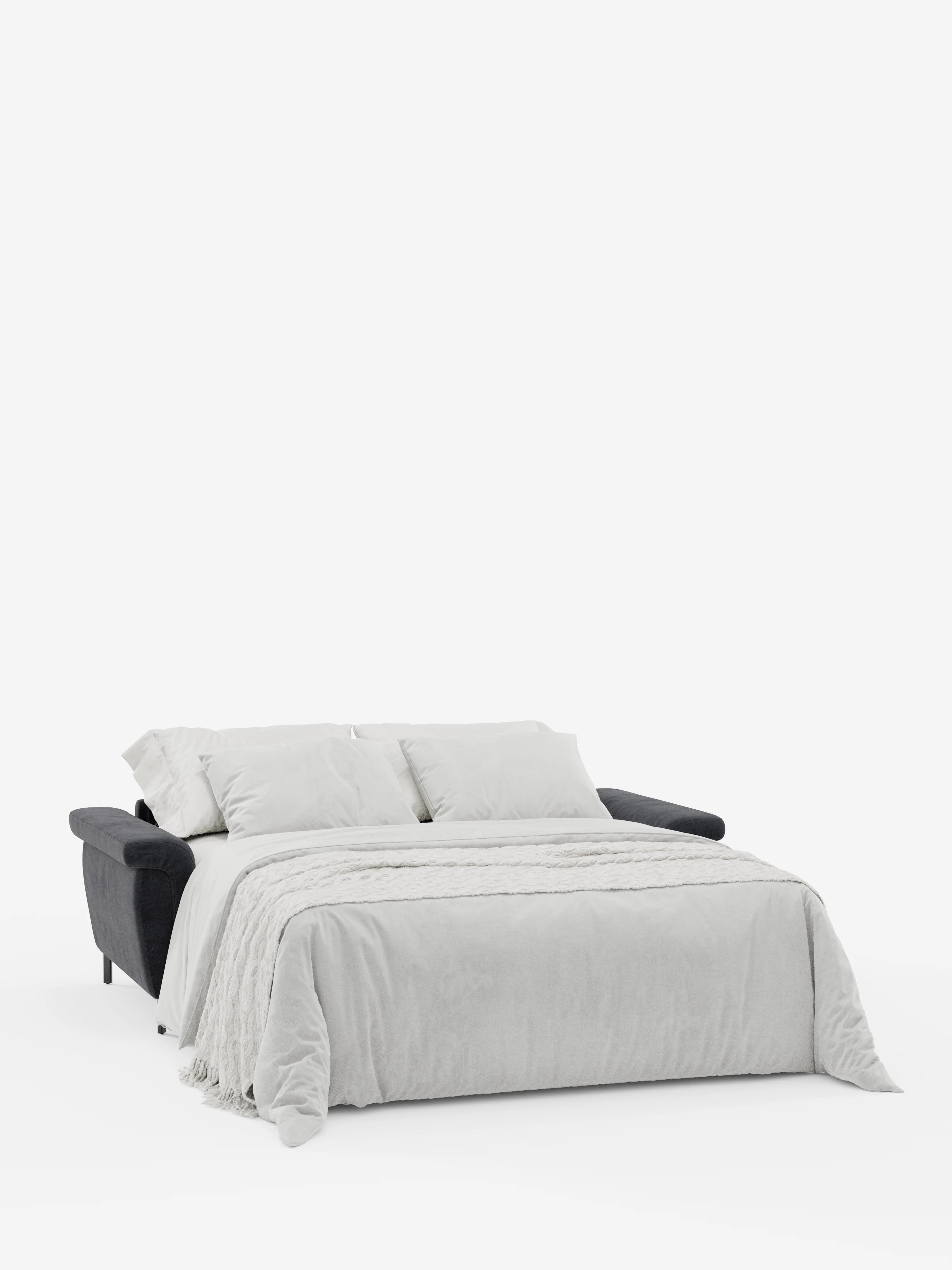 Su uno sfondo bianco a tinta unita, il divano letto di design Capri con piedini alti di divitt.sbs — rivestito in raffinato tessuto T30 effetto velluto, resistente alle macchie, in un moderno grigio scuro — è aperto e abbellito da una biancheria da letto grigio chiaro, composta da un piumone, tre grandi cuscini e un plaid con frange. I suoi poggiatesta regolabili ne esaltano il fascino contemporaneo.