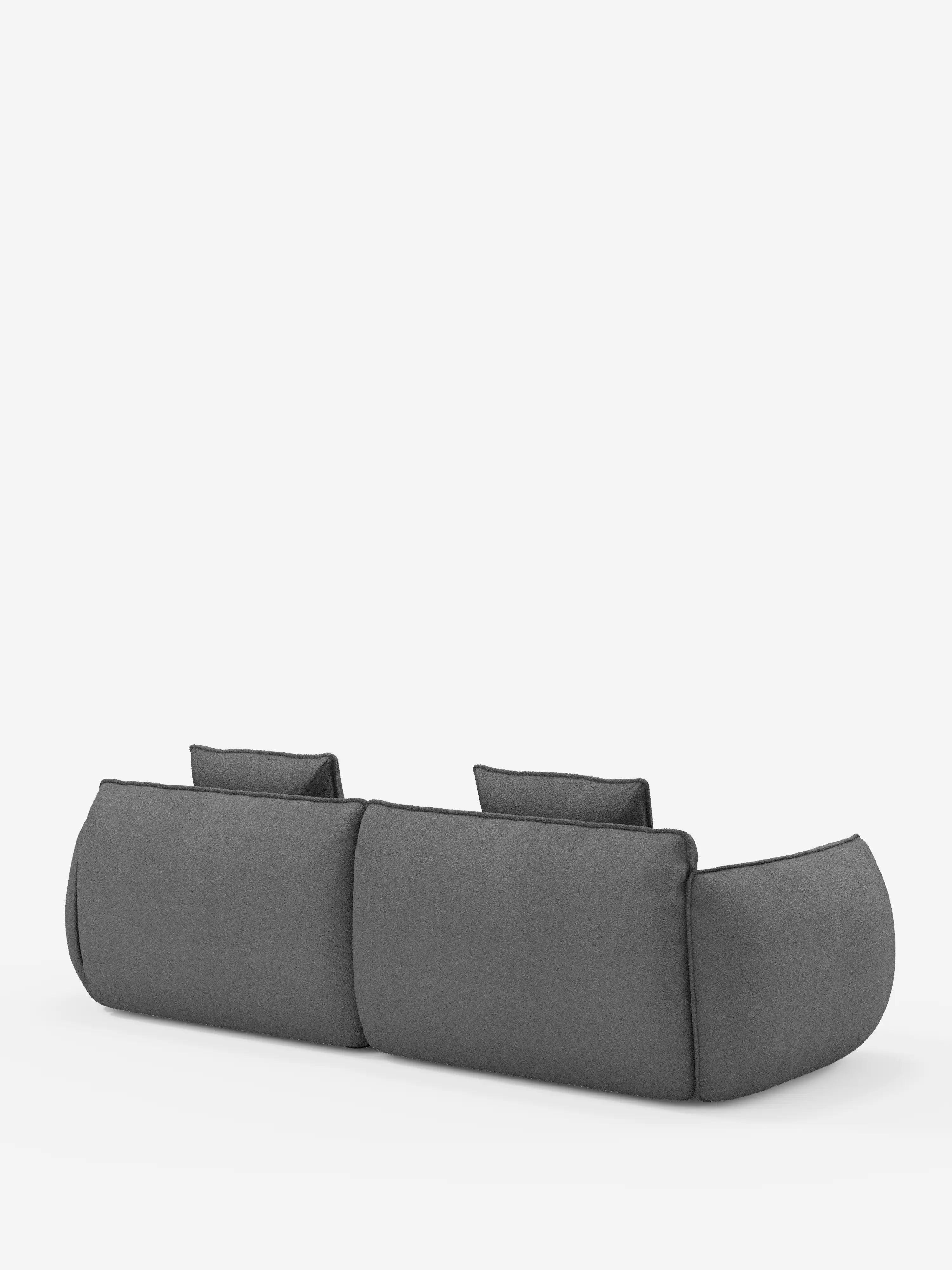 Il divano Nimbus, un modello moderno e dal profilo basso, a 3 posti, modulare e componibile da 250 cm di divitt.sbs, è raffigurato di retro. Rivestito in tessuto grigio smacchiabile effetto cotone T33, presenta due ampie sezioni di seduta e due cuscini rettangolari per lo schienale. Il design minimalista mette in risalto i bordi arrotondati e i fianchi morbidi e imbottiti, il tutto su uno sfondo bianco a tinta unita.