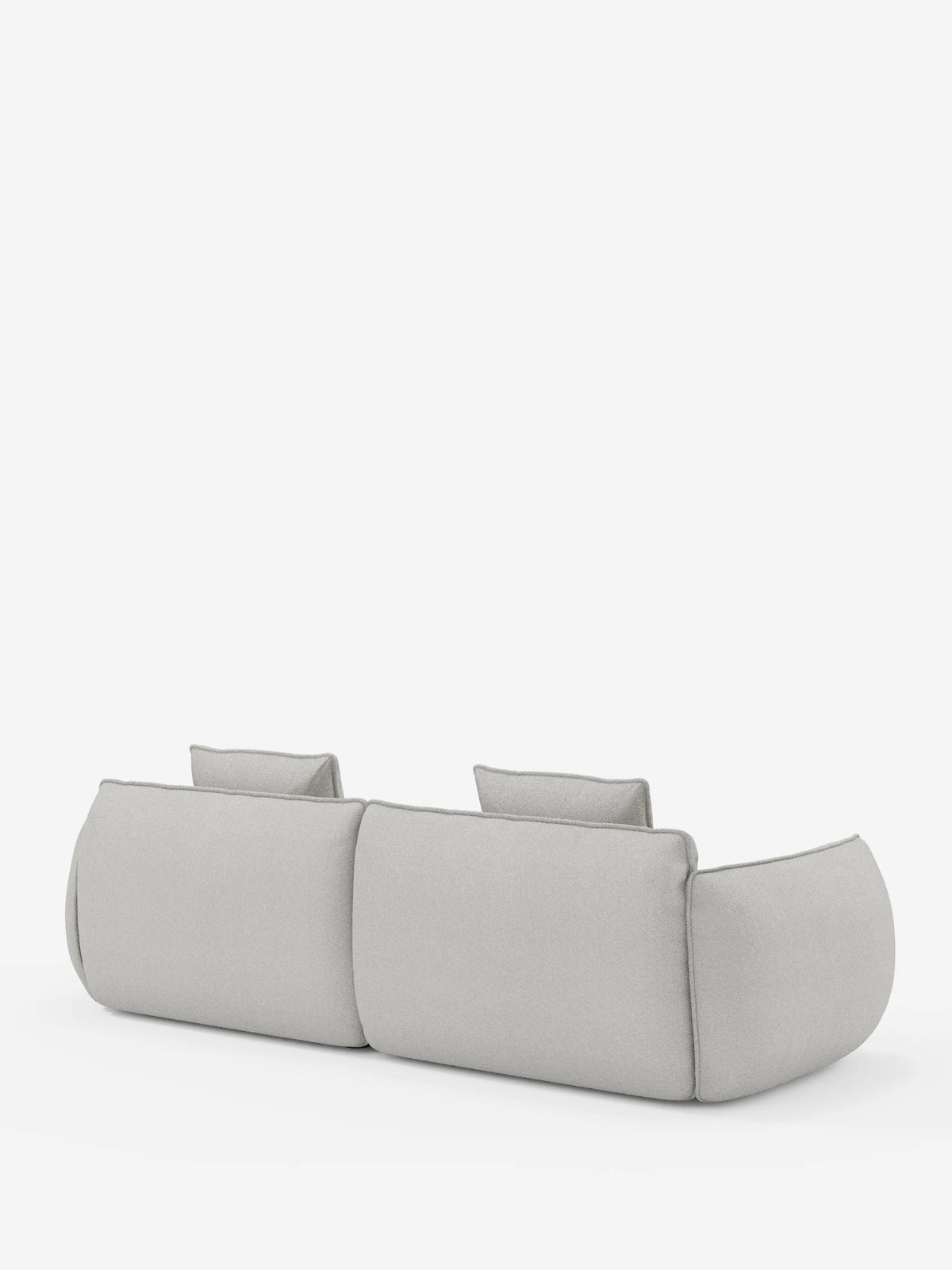 Un divano Nimbus contemporaneo a 3 posti, modulare e componibile, firmato divitt.sbs, lungo 250 cm e rivestito in tessuto effetto cotone grigio chiaro antimacchia (T33), è ripreso di spalle su uno sfondo bianco a tinta unita. Il divano presenta bordi arrotondati, un'imbottitura spessa e due schienali rettangolari dal profilo basso.
