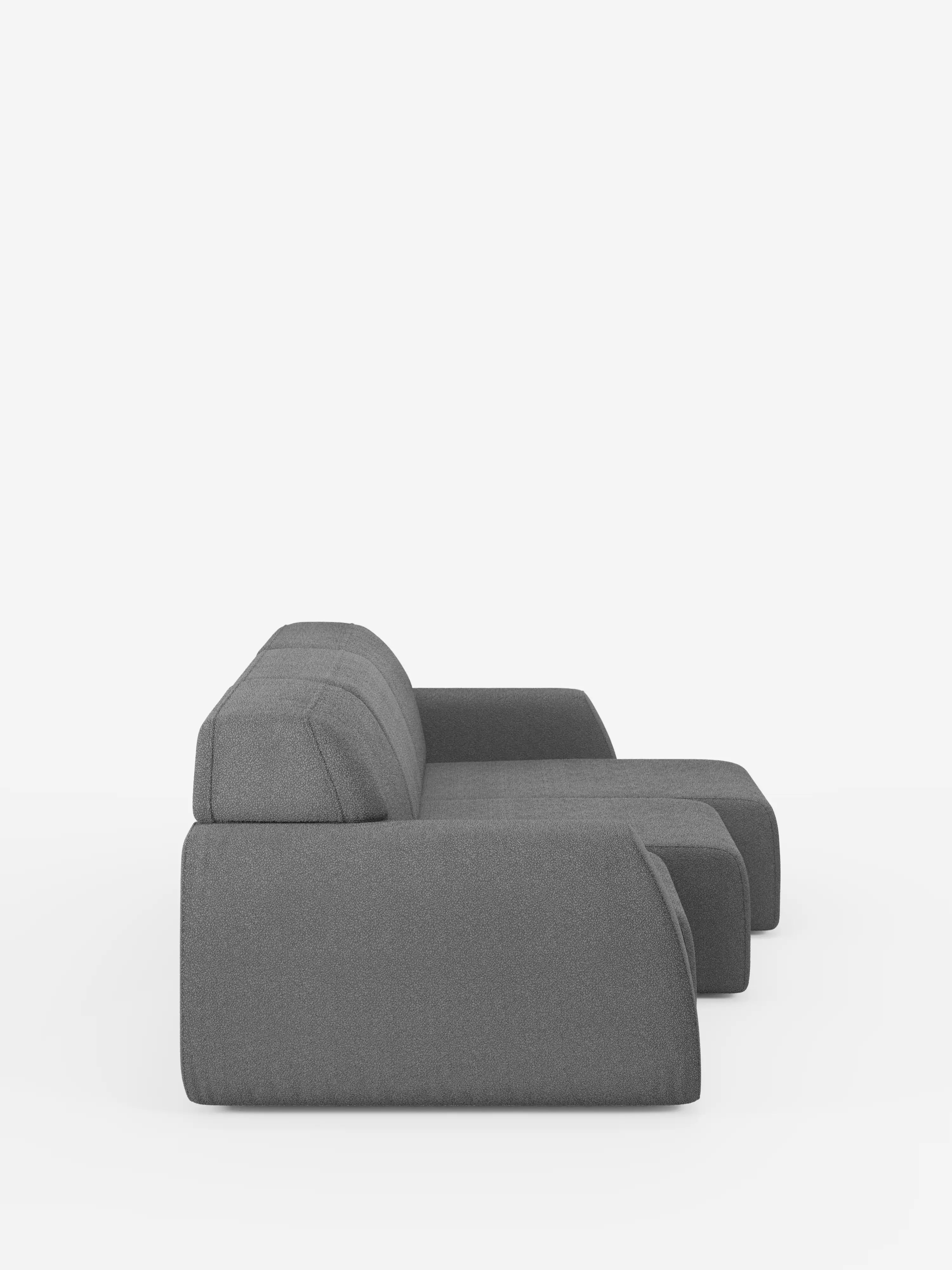 Il divano Orbit, un modello moderno e minimalista in tessuto grigio, con 3 sedute scorrevoli ed estensibili in tessuto effetto cotone smacchiabile T33 di divitt.sbs, è ripreso di profilo e presenta braccioli angolati e uno schienale basso. Con le sue linee pulite e squadrate e le sedute scorrevoli ed estensibili regolabili indipendentemente per un comfort personalizzabile, questo divano sfoderabile spicca su uno sfondo bianco a tinta unita.