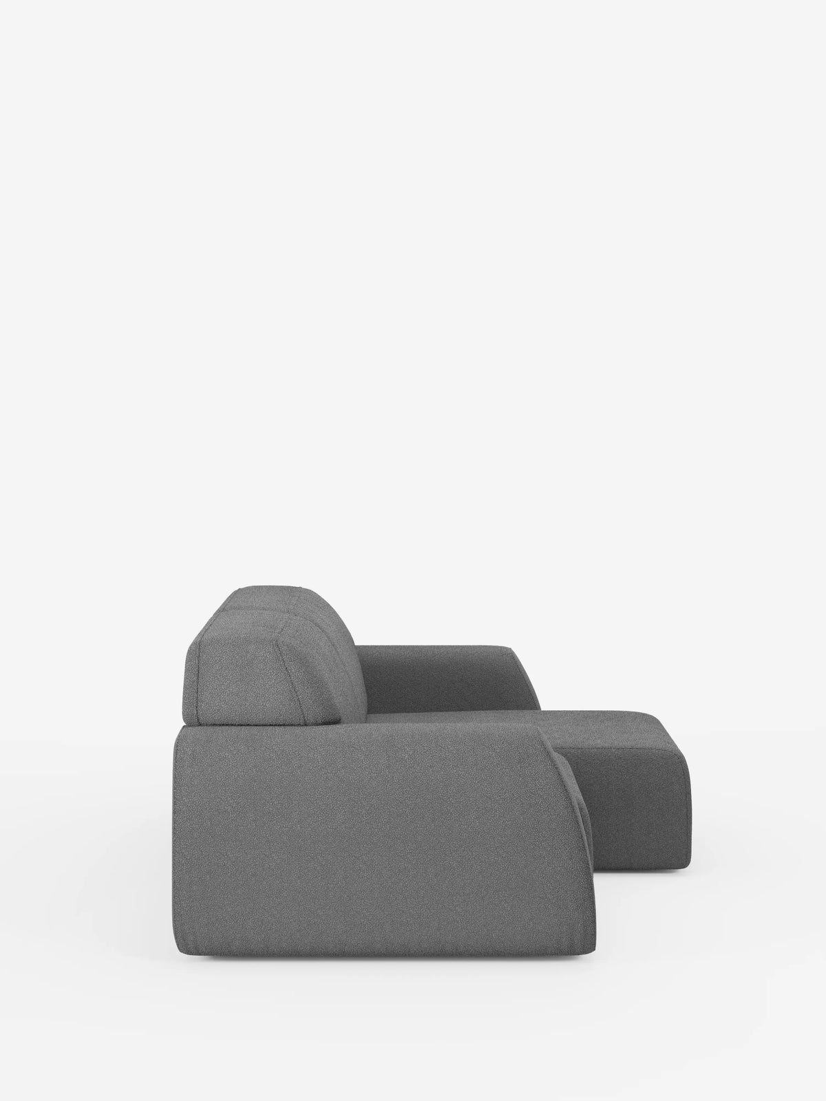 Il divano Orbit a 2 e 3 posti con sedute scorrevoli di divitt.sbs è raffigurato in una vista laterale su sfondo bianco. Completamente sfoderabile in tessuto smacchiabile effetto cotone T33, questo divano moderno presenta un design contemporaneo caratterizzato da linee morbide e pulite, una seduta ampia e uno schienale leggermente inclinato. Dallo stile minimalista e modulare, il divano Orbit è privo di gambe e decorazioni a vista, per un look elegante e discreto.