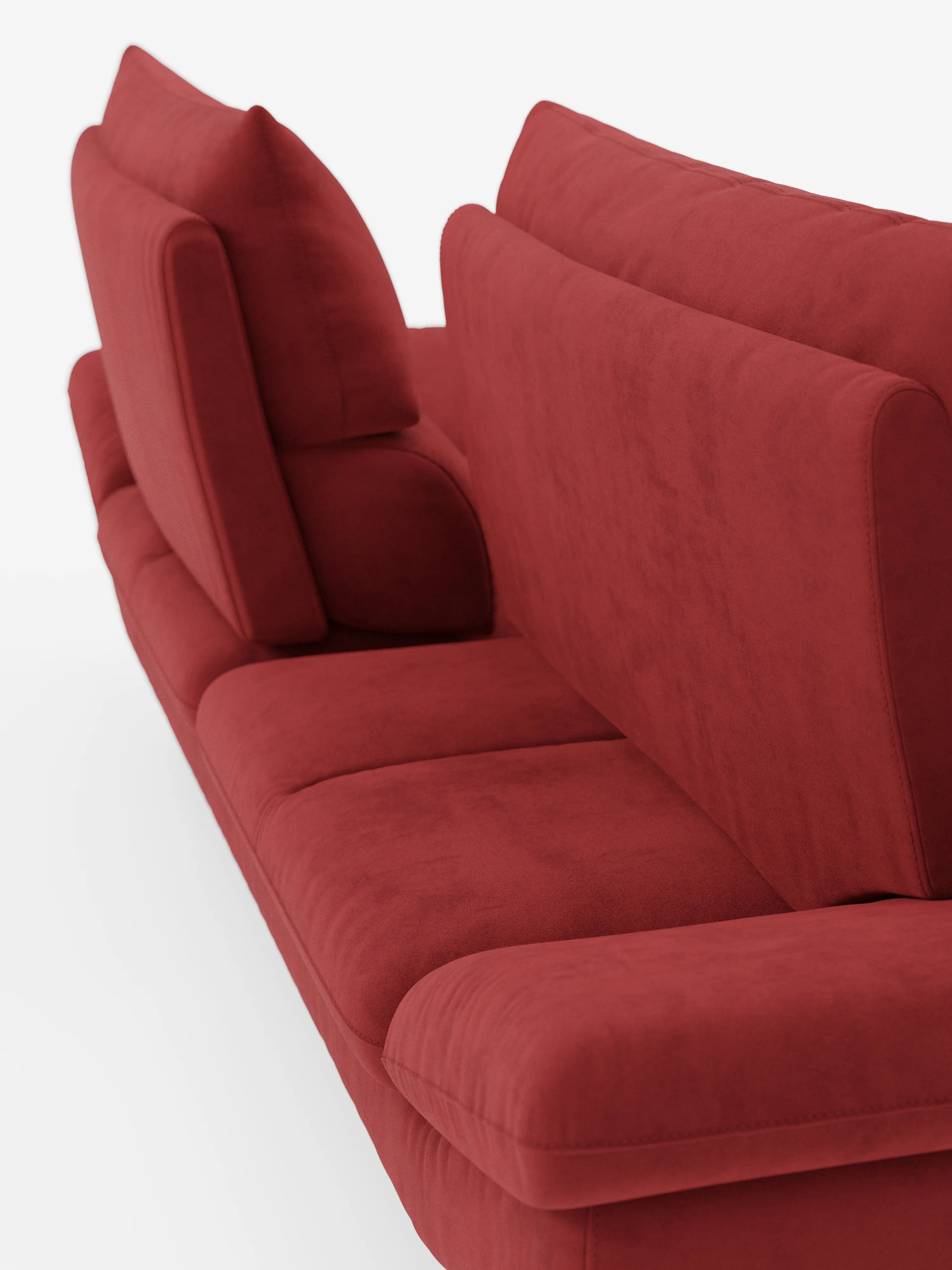 Una vista laterale ravvicinata del divano Eclipse, un modello dal design moderno a 2 e 3 posti con schienali scorrevoli di divitt.sbs, rivestito in elegante microfibra T11 resistente alle macchie e caratterizzato da morbidi cuscini, braccioli e linee pulite e minimaliste. Il divano è magnificamente valorizzato da alti piedini in metallo color titanio e fa da contrappunto a uno sfondo bianco.