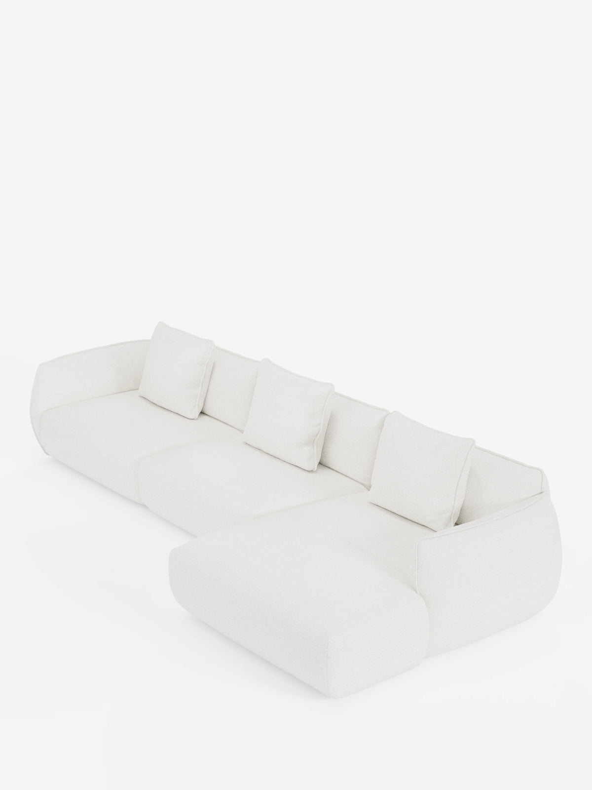 Il divano angolare con penisola componibile Nimbus di divitt.sbs è un divano componibile moderno, di colore bianco, realizzato in morbido tessuto effetto cotone resistente alle macchie (T33), dotato di quattro cuscini dello schienale, ampi braccioli e una chaise longue allungata sul lato sinistro, raffigurato su uno sfondo bianco a tinta unita.