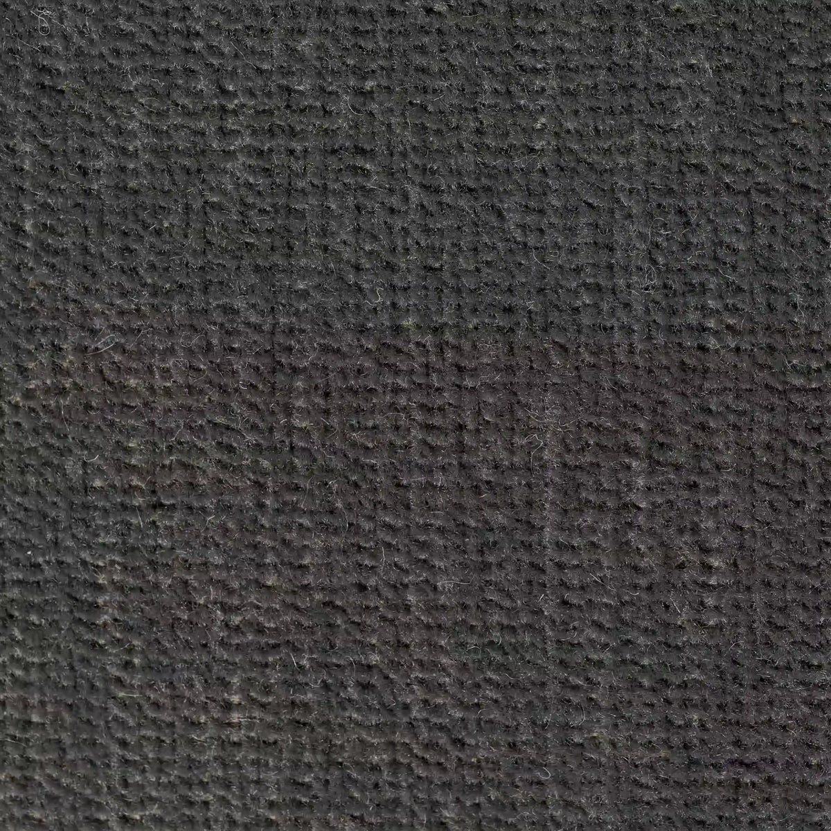 Primo piano di Bolero cuscino di divitt.sbs in tessuto T31 grigio scuro. Il materiale, morbido, antimacchia, impermeabile e non restringente, presenta un motivo a griglia con fibre visibili e una trama consistente. Disponibile in vari colori.