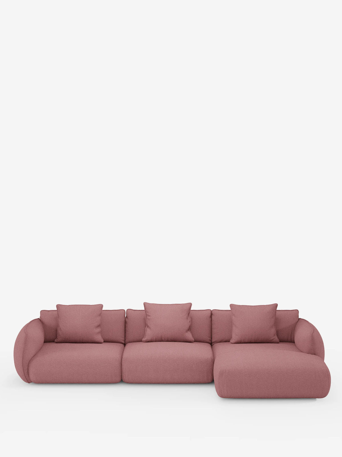 Il divano angolare con penisola componibile Nimbus di divitt.sbs è un divano componibile moderno di colore rosa, realizzato in morbido tessuto T33 effetto cotone resistente alle macchie, dotato di quattro cuscini schienali e di una chaise longue a destra, presentato su uno sfondo bianco a tinta unita.