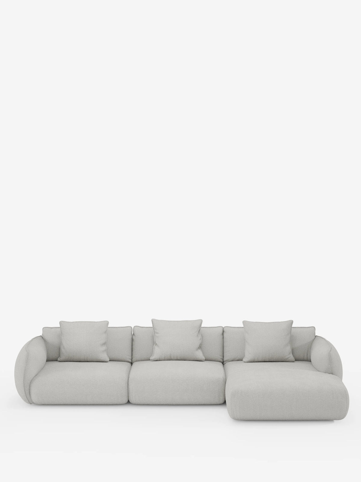 Vi presentiamo il divano angolare con penisola componibile Nimbus in morbido tessuto effetto cotone smacchiabile T33 di divitt.sbs: un divano componibile moderno, di colore grigio chiaro, composto da tre cuscini di seduta, una chaise longue sul lato destro e quattro cuscini quadrati coordinati. Questo divano moderno in stile contemporaneo vanta braccioli arrotondati e un design minimalista, messo in risalto da uno sfondo bianco a tinta unita.