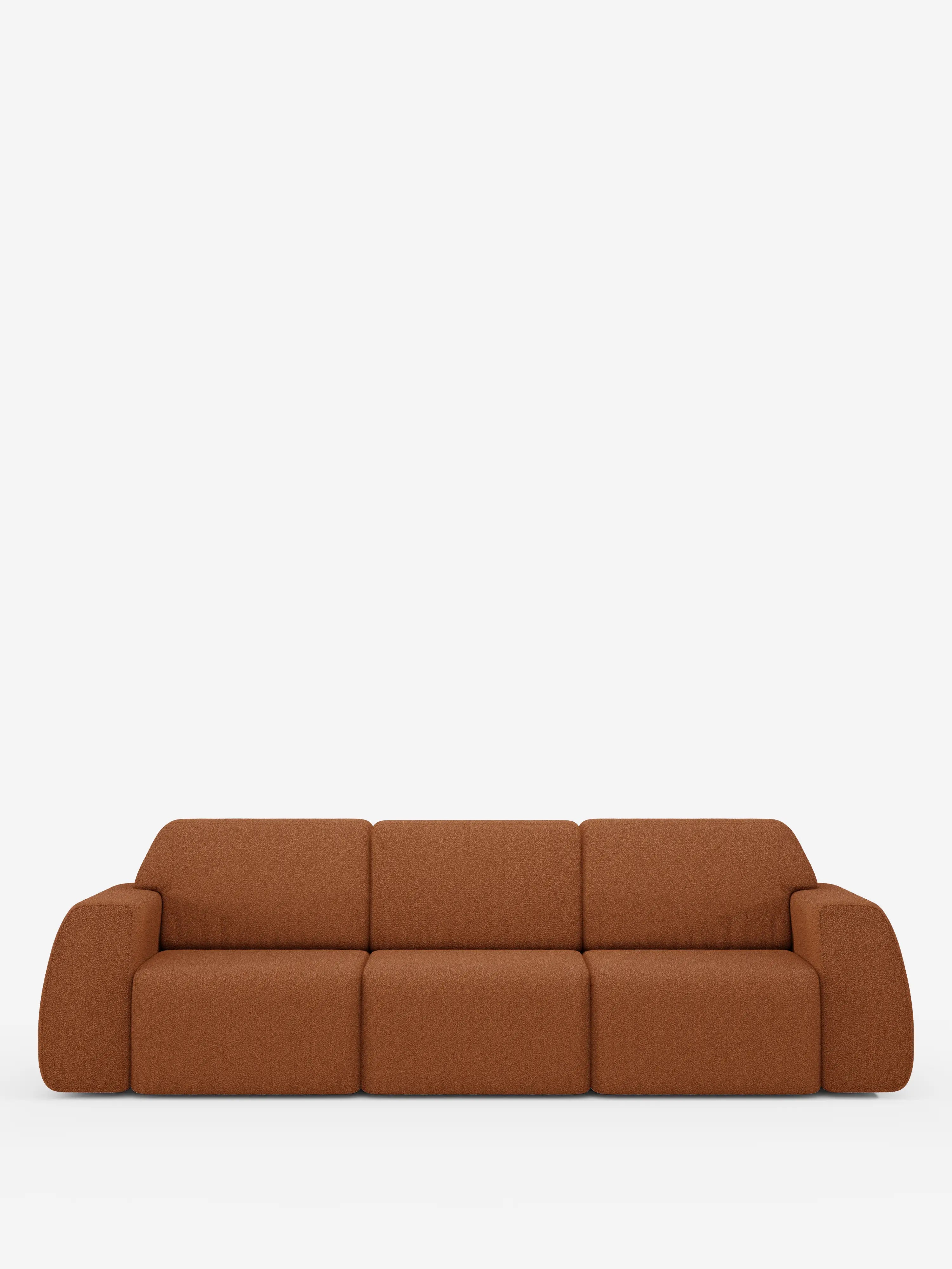 Un divano Orbit moderno e minimalista con 3 sedute scorrevoli e allungabili di divitt.sbs, color arancione bruciato, caratterizzato da braccioli e schienali arrotondati che conferiscono un aspetto morbido sullo sfondo bianco a tinta unita. Rivestito in tessuto smacchiabile effetto cotone T33, questo divano si caratterizza per un profilo basso e un design senza soluzione di continuità, privo di gambe a vista o dettagli decorativi. Il modello è completamente sfoderabile, garantendo una facile manutenzione