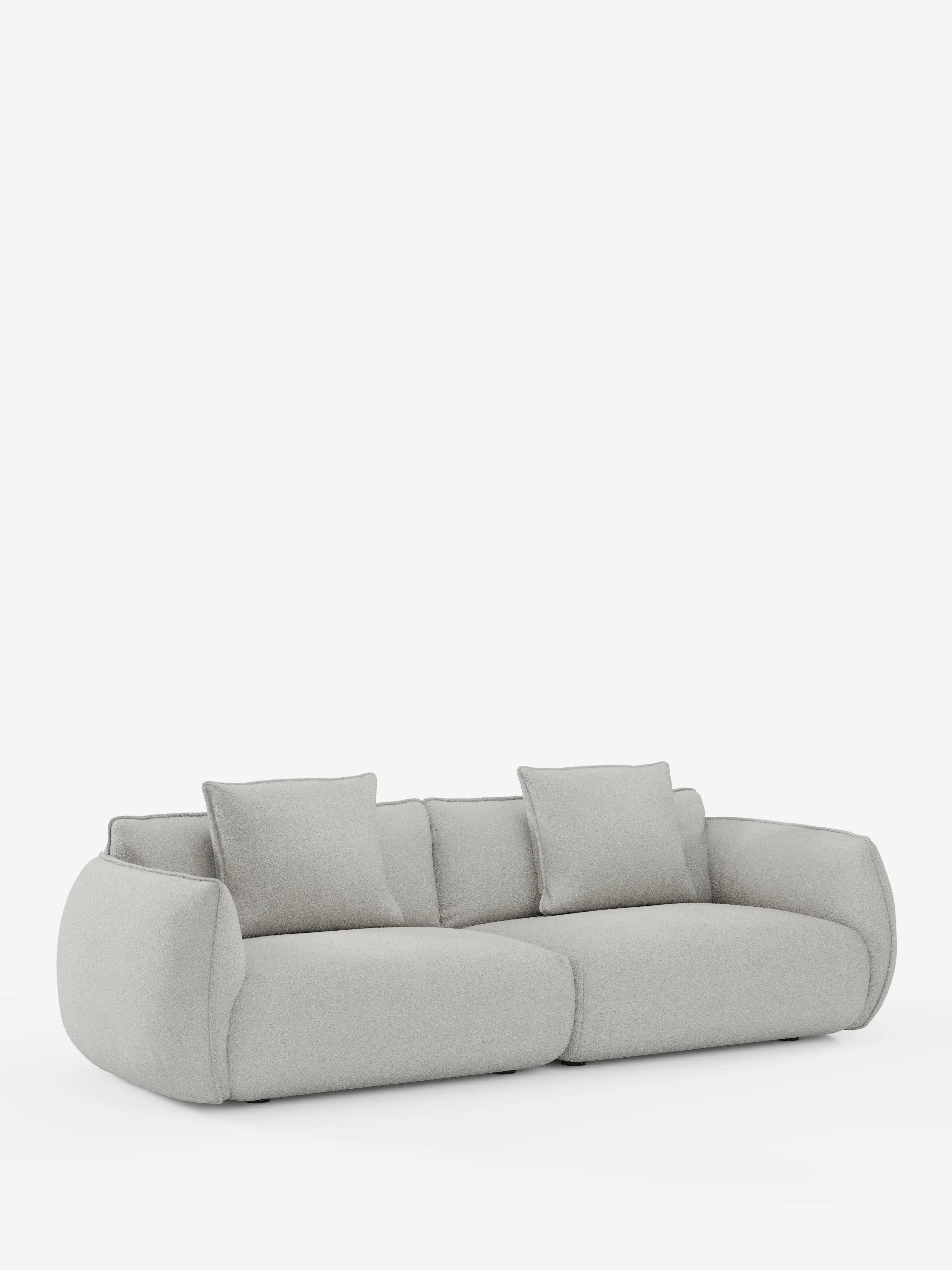 Un divano Nimbus contemporaneo a 3 posti, modulare e componibile, firmato divitt.sbs, realizzato in tessuto effetto cotone grigio chiaro resistente alle macchie (t33). Questo divano si caratterizza per il profilo basso, i bordi arrotondati e i morbidi cuscini imbottiti. Comprende quattro cuscini di seduta e due cuscini dello schienale abbinati. In primo piano su uno sfondo bianco a tinta unita, spicca il design minimalista di questo divano sfoderabile da 250 cm.