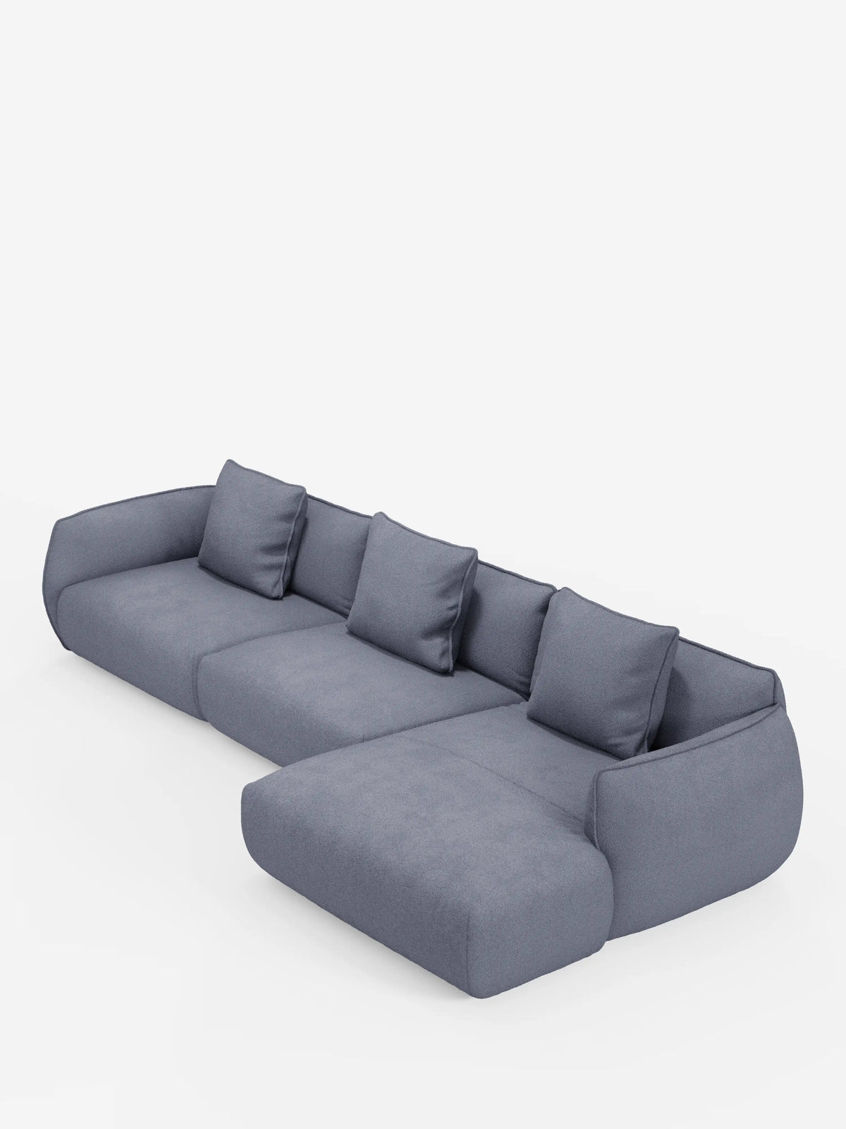 Un divano angolare con penisola componibile Nimbus, moderno e spazioso, di divitt.sbs, rivestito in tessuto T33 effetto cotone grigio medio, smacchiabile, con quattro cuscini dello schienale sfoderabili e un’ampia chaise longue sul lato destro. Questo divano moderno presenta linee arrotondate e minimaliste e braccioli dal profilo basso, che risaltano su uno sfondo bianco a tinta unita.
