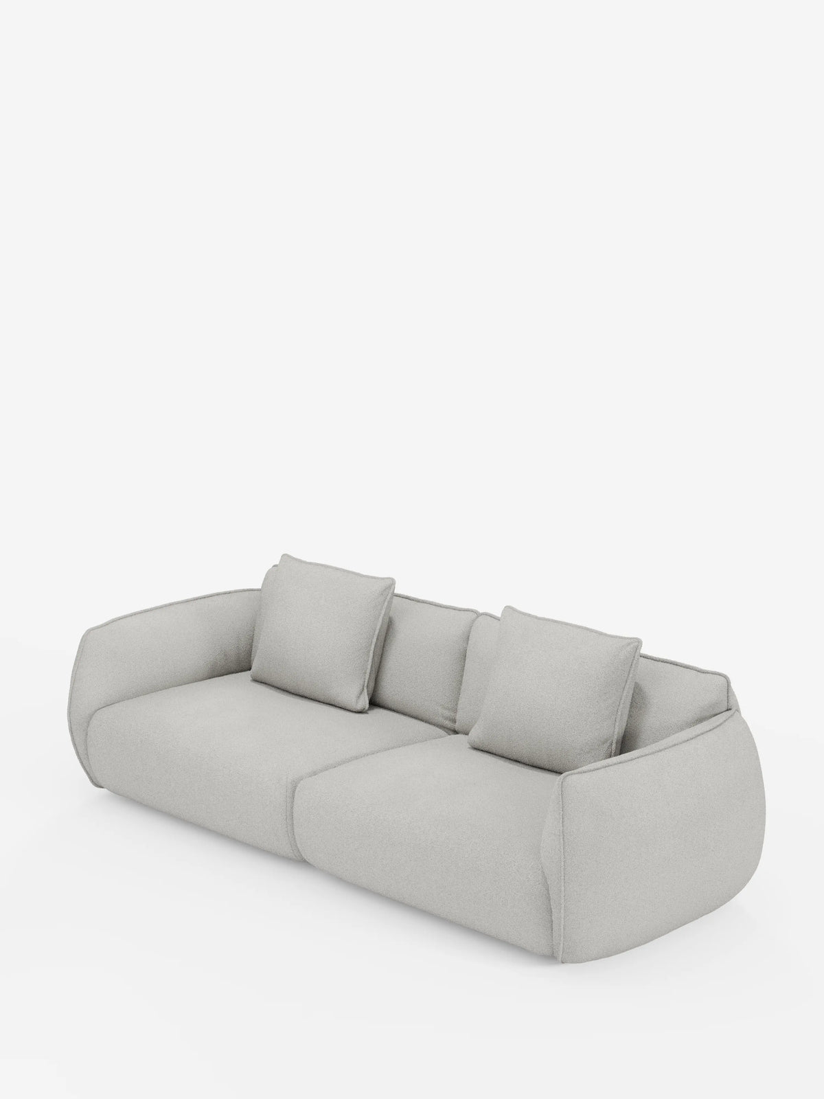 Un divano modulare e componibile Nimbus a 3 posti dal design moderno e dal profilo ribassato, firmato divitt.sbs, in grigio chiaro, rivestito con tessuto effetto cotone sfoderabile e antimacchia (t33), dotato di due cuscini di seduta, due cuscini decorativi quadrati abbinati e ampi braccioli arrotondati che ne caratterizzano il design minimalista. Il prodotto è presentato su uno sfondo bianco a tinta unita.