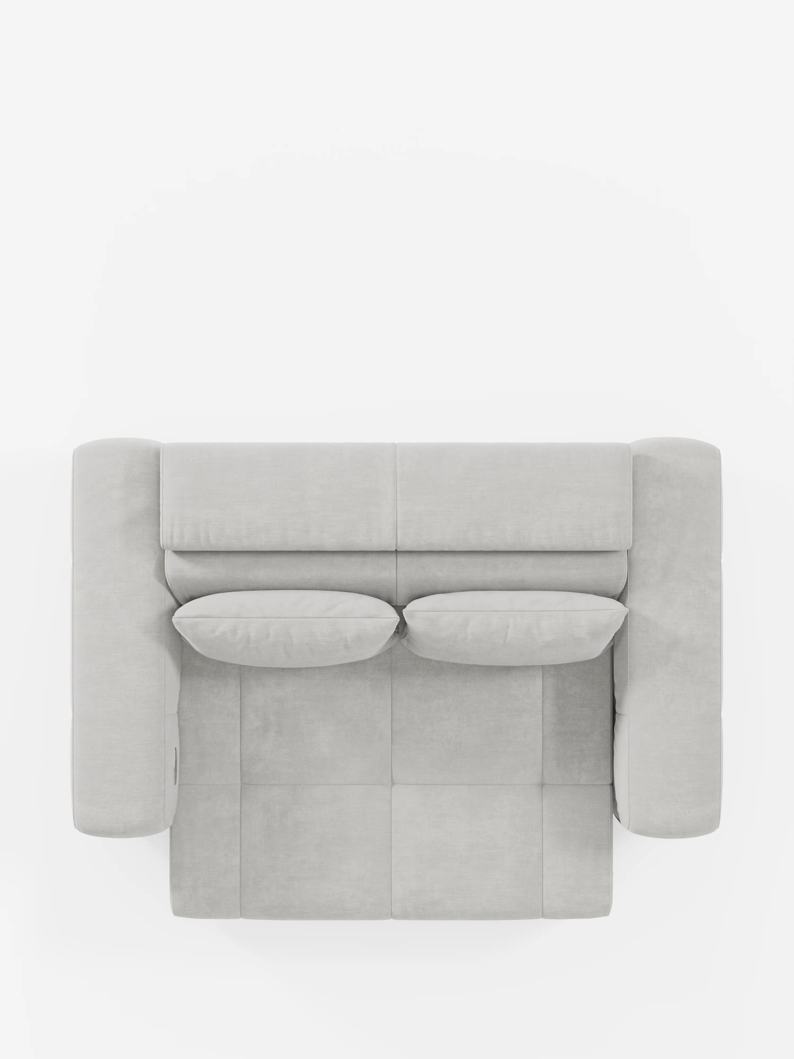 Vista dall’alto del divano Monarch con funzione relax elettrica per l’allungamento delle sedute e poggiatesta reclinabile di divitt.sbs, rivestito in morbido tessuto T31 resistente alle macchie, color grigio chiaro. Questo divano moderno è dotato di due cuscini dello schienale, due cuscini di seduta e braccioli spessi e arrotondati su entrambi i lati. Il suo design squadrato e minimalista esalta l’estetica raffinata di un divano elegante su uno sfondo bianco a tinta unita.