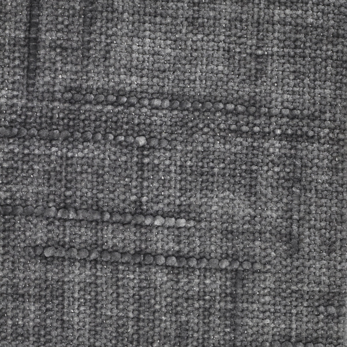 Un primo piano della Personalizzazione nel modello T22 KIMONO, che mostra un tessuto grigio scuro dall’aspetto intrecciato e testurizzato, caratterizzato da un motivo ripetuto di linee orizzontali formate da fili in rilievo e irregolari su uno sfondo neutro a trama fitta.