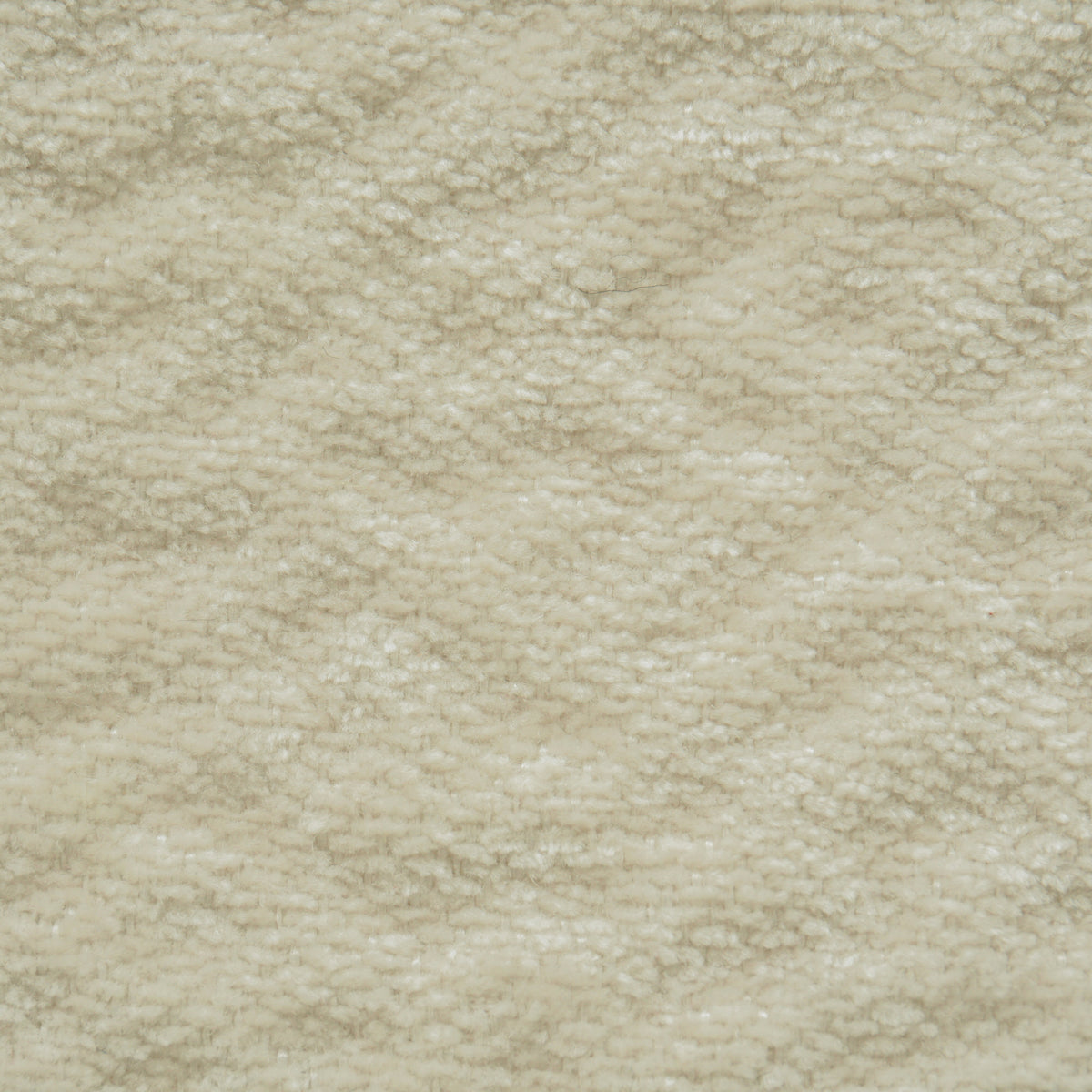 Un primo piano della Personalizzazione nella T27 BREZZA, caratterizzata da un morbido tessuto color crema con un pelo fitto e strutturato e un delicato motivo ondulato creato dalla trama a riccioli delle fibre.