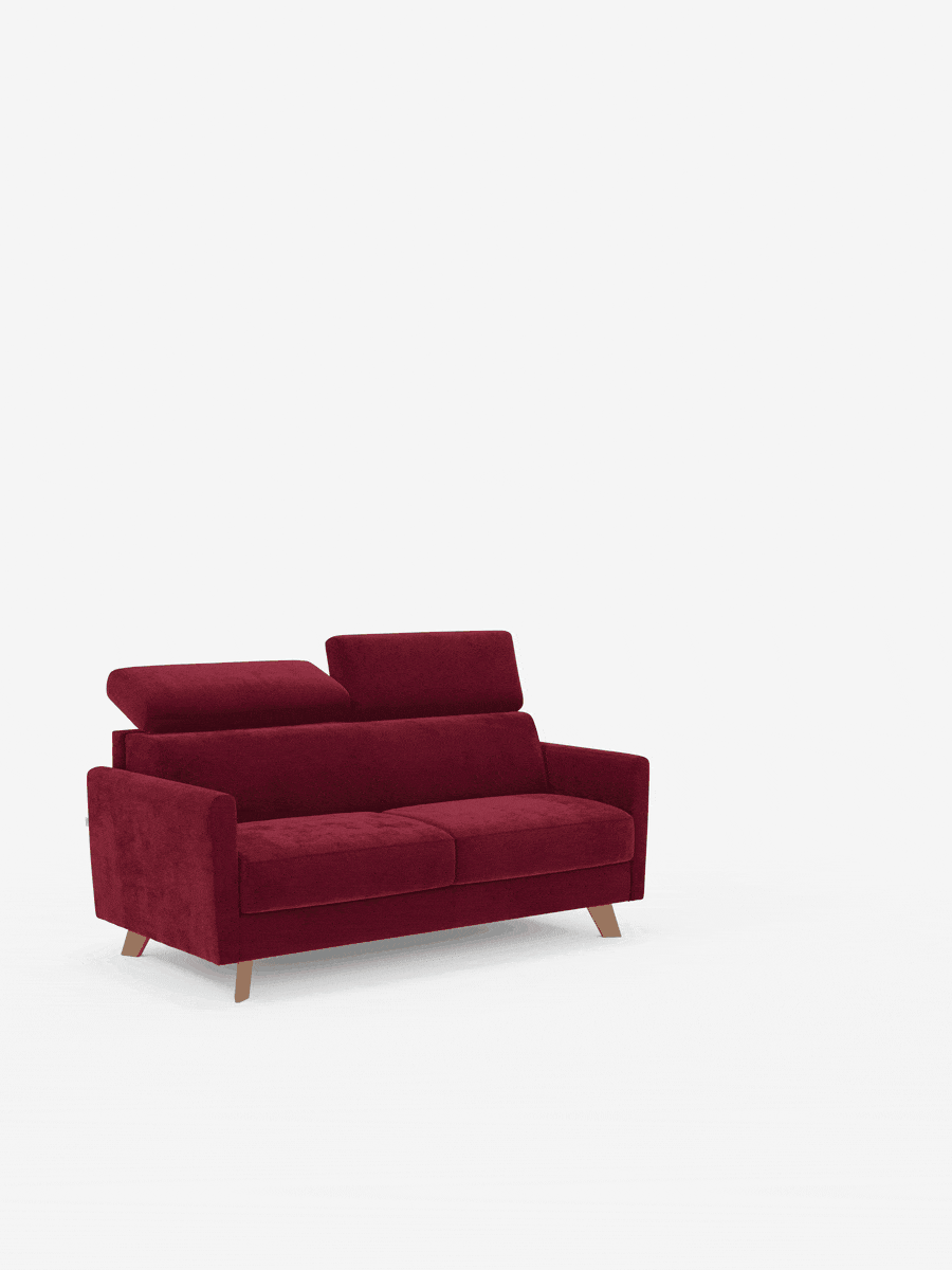 Un divano letto a due posti Francy in stile contemporaneo di divitt.sbs, rivestito in tessuto T30 simile al velluto, di colore rosso intenso e resistente alle macchie, con due poggiatesta regolabili e gambe corte in legno. Il divano, dallo stile minimalista, è completamente sfoderabile ed è posizionato leggermente a sinistra su uno sfondo bianco a tinta unita.