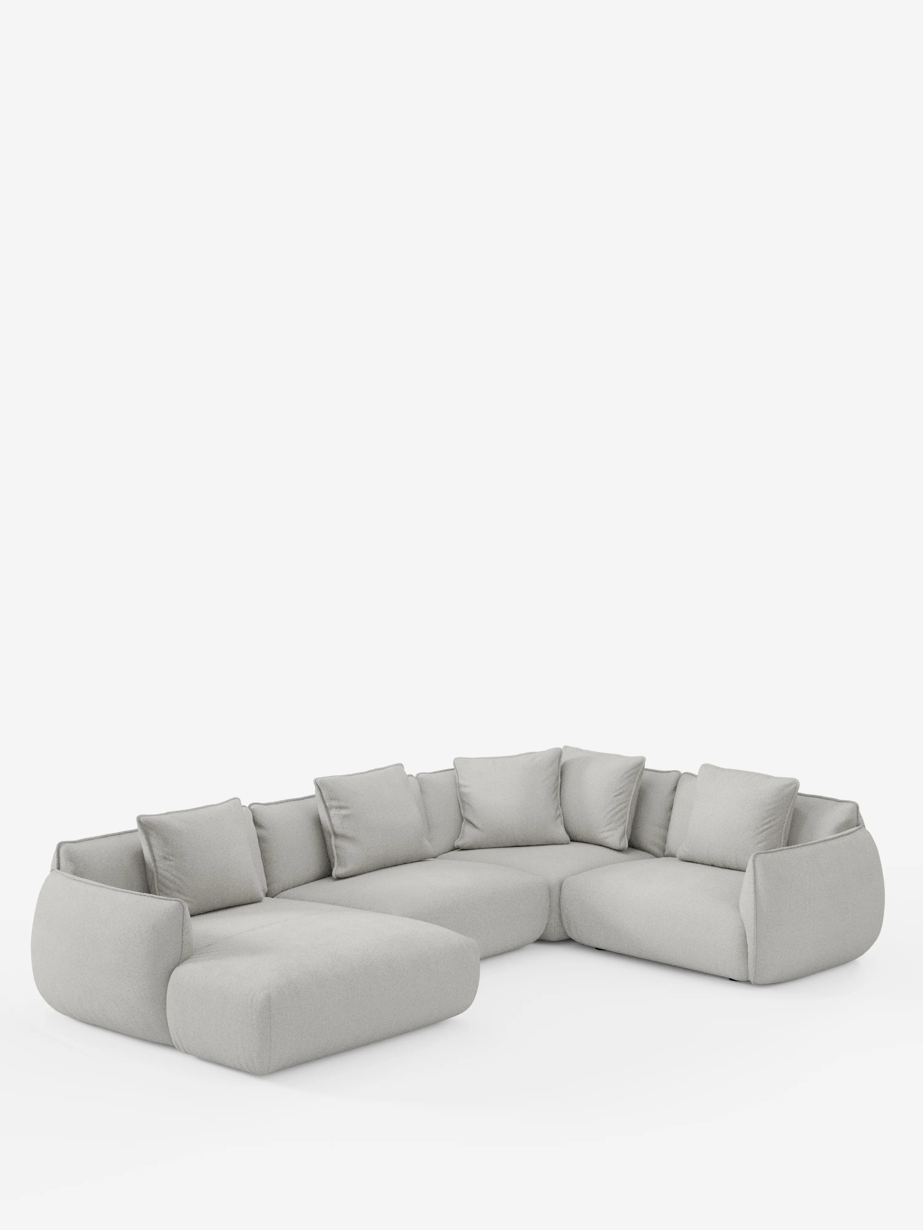 Divano angolare panoramico componibile Nimbus, in stile moderno, color grigio chiaro, con sei cuscini di seduta, sette cuscini dello schienale sfoderabili e bordi arrotondati, di divitt.sbs. Rivestito in morbido tessuto T33 resistente alle macchie, questo divano componibile minimalista Made in Italy presenta una configurazione con chaise longue e angolo. Immagine raffigurata su sfondo bianco.