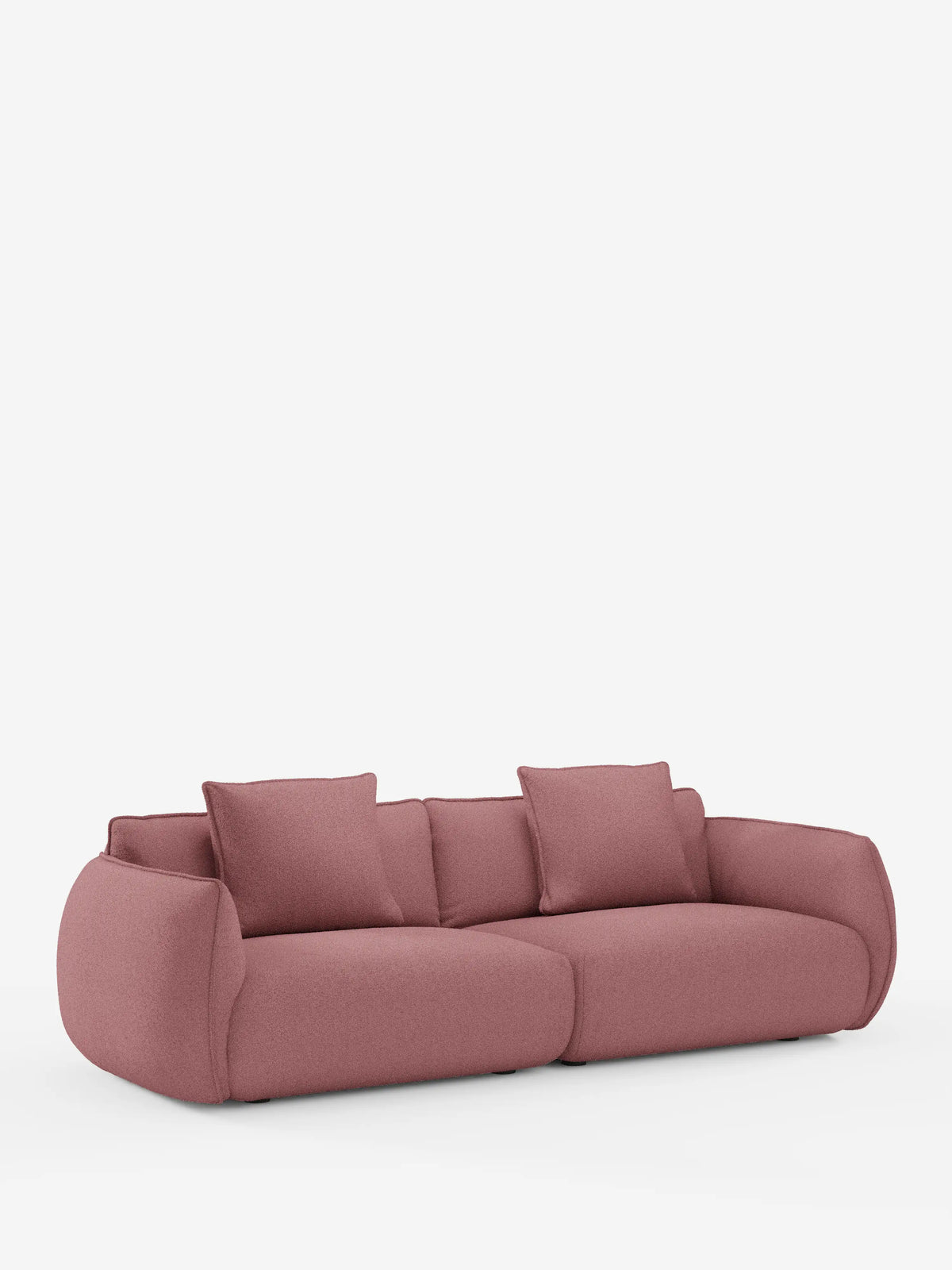 Un divano modulare e componibile Nimbus a 3 posti da 250 cm, moderno e lussuoso, nei toni del rosa malva, di divitt.sbs, rivestito in tessuto sfoderabile effetto cotone resistente alle macchie (t33), con sedute profonde, braccioli larghi e due cuscini dello schienale abbinati. Il divano presenta un design morbido e arrotondato che lo rende eccezionalmente confortevole e si distingue su uno sfondo bianco a tinta unita.