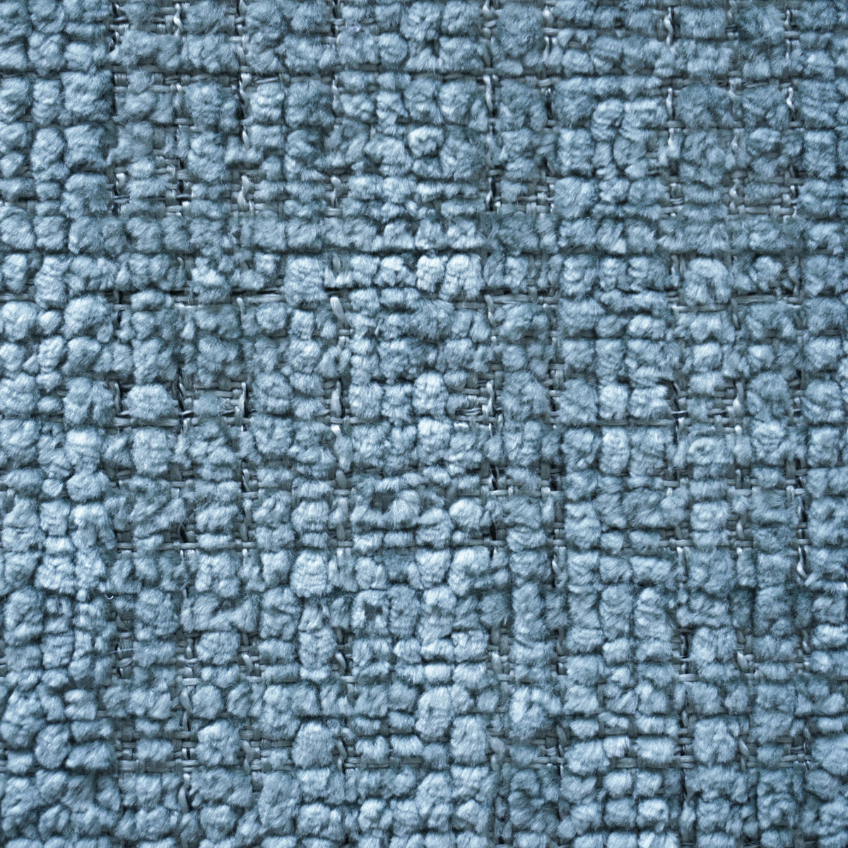 Un primo piano del tessuto “Personalizzazione” della linea T28 RIVER, caratterizzato da un motivo a griglia intrecciata di colore blu polveroso, composto da fibre spesse e morbide intervallate da fili più sottili e più scuri.